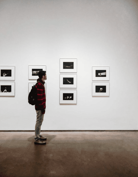 Man viewing art in an art gallery.