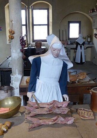 Model of nun preparing rabbit. Rabbit starvation is also known as protein poisoning.