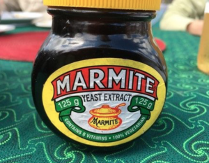 Photo of Marmite jar with earthenware cooking pot on label. Photo for article on Marmite history and anemia treatment