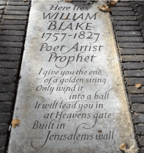 Gravestone reading "Here lies / William / Blake / 1757-1827 / Poet • Artist / Prophet / I give you the end of a golden string / Only wind it into a ball / It will lead you in at Heavens gate / Built in Jerusalems wall"