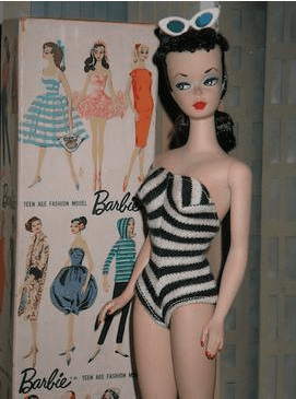 Brunette Barbie in a black and white striped swimsuit looking sideways. Photo for article on Barbie syndrome
