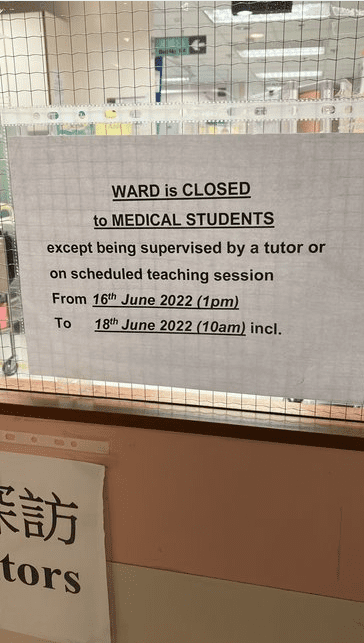Sign reading "WARD is CLOSED to MEDICAL STUDENTS except being supervised by a tutor or on scheduled teaching session From 16th June 2022 (1pm) To 18th June 2022 (10am) incl." in the window of a door