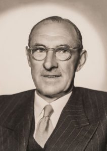 Sir Norman Gregg who developed the rubella vaccine, a man in a suit and glasses